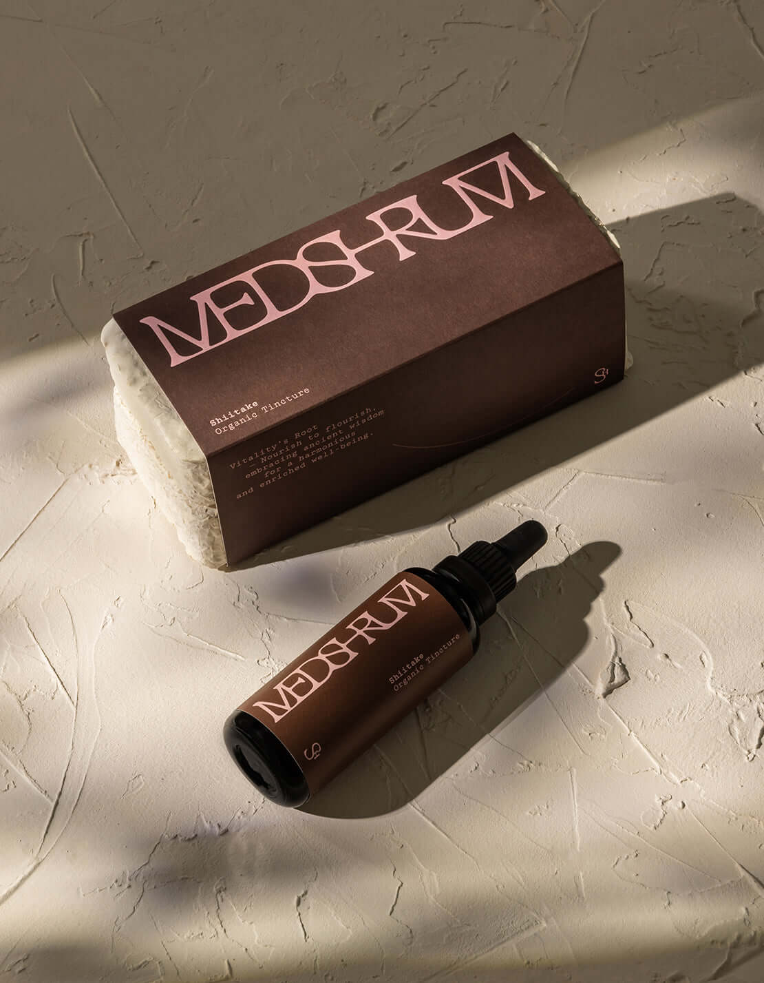 Medshrum Shiitake Organic Tincture bottle and packaging on textured background, promoting natural immune support.